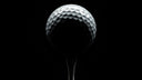 Custom golf ball with personalized design on tee showcasing Golf Swag customization options